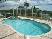 Good pool setup with a spillover spa.  Paver pool deck.